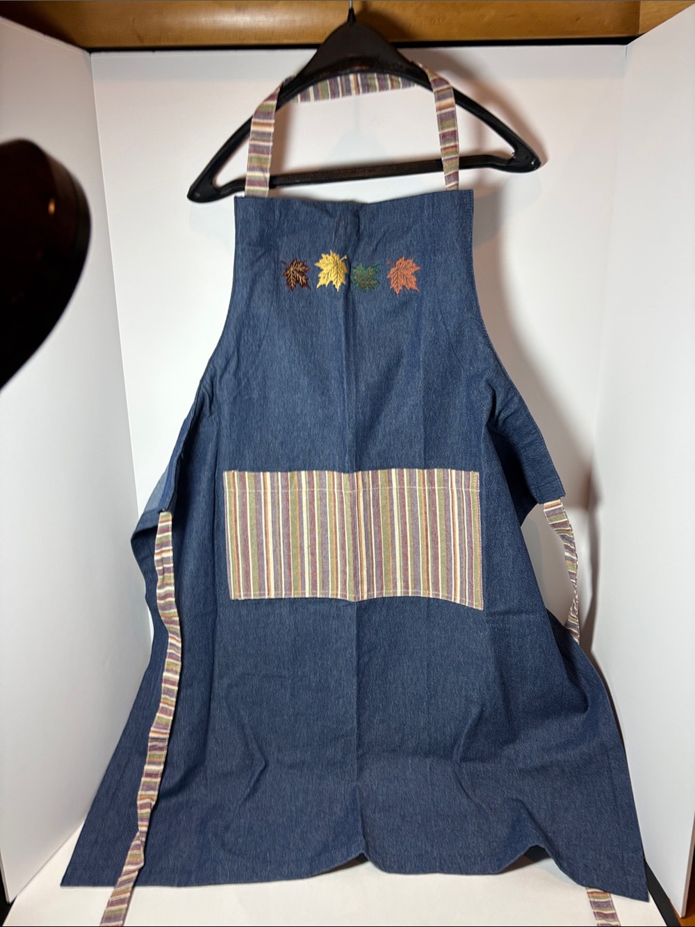 Adult Denim-Style Blue Apron with Striped Pockets and fall leaves.